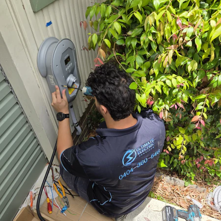 Electrician installing Myenergi Zappi solar EV Charger